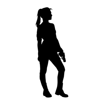 Silhouette of a woman fighter in pose carrying hand gun or pistol glock weapon.
