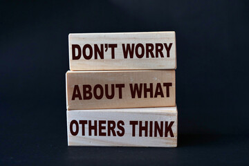 Dont worry about what others think, quote text written on wooden block, motivation inspiration
