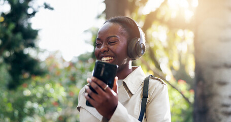 Smile, phone and woman with headphones for fun, funny and podcast or song, energy and relax in...