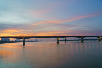 Vinh Tuy bridge crossing Red river in Hanoi during twilight