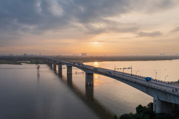 Fototapeta na wymiar Vinh Tuy bridge crossing Red river in Hanoi