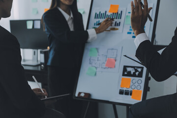 Business team working with new startup project plan and discussion information for financial strategy with laptop and digital tablet in a modern business lounge.