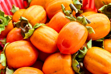Persimmon fruits background.