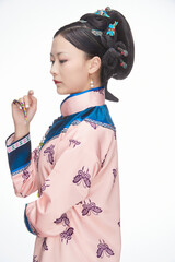 A Asian woman dressed in Qing Dynasty Empress attire