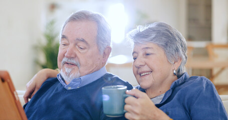 Tablet, coffee and smile with an old couple in their home to relax together during retirement for...