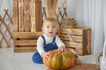 Close-up portrait of a beautiful child with white hair and blue eyes, smiling and looking at the camera