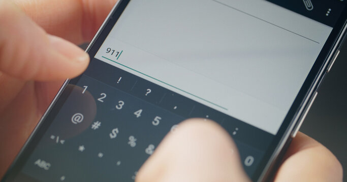 Woman typing a text message on a smartphone. Closeup shot.
