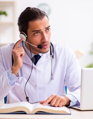 Young doctor listening to patient during telemedicine session