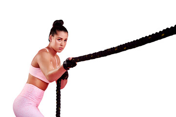 Woman pull battle rope for sports, exercise and serious while isolated on a transparent png...