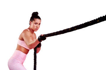 Woman pull battle rope for sports, exercise and serious while isolated on a transparent png background. Strong female athlete, workout and training with weights of ropes for fitness, muscle and power