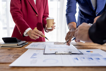 Financial Business team analyze the graph of the company's performance to create profits and...