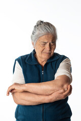 elbow pain. elderly woman holding her elbow, tendinitis concept. White background.