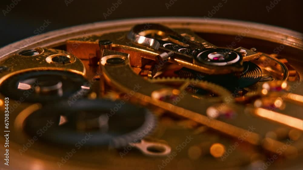 Poster mechanism and gears of an old pocket watch. macro close up shot. low angle slow motion shot with cam
