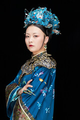 A Asian woman dressed in Qing Dynasty Empress attire