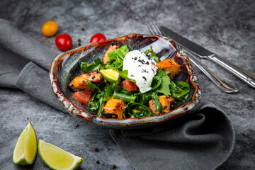 salad with spinach, eel, lime, sour cream, side view