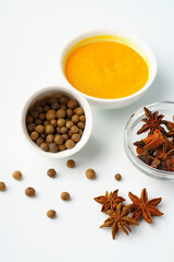 Allspice and anise stars on white background