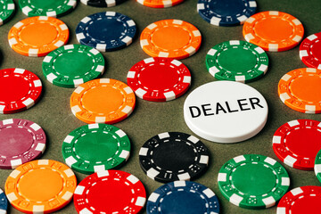 Lots of poker chips on green background