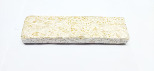 Tempeh is a typical Indonesian food made from fermented soybeans. tempeh isolated on white background