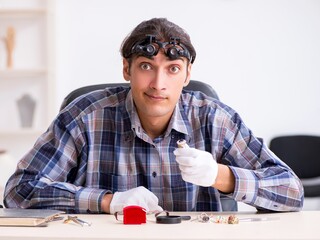 Young male jeweler at workshop