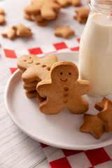 Homemade gingerbread man cookies and milk, traditionally made at Christmas and the holidays.
