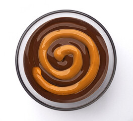 Caramel and chocolate cream swirl isolated on white background, top view