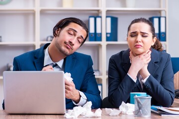 Two employees suffering at workplace