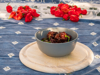 Brown hot Pot Congo Chili fruits on plate in close up view