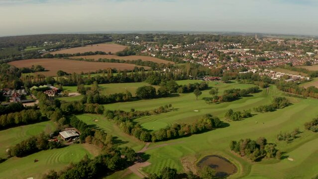 Aerial shot over golf course towards Epping town