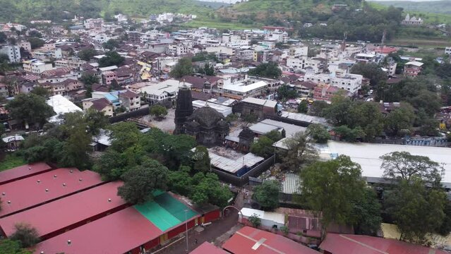 Aerial view of Trimbakeshwar Jyotirling Temple dedicated to Lord Shiva, Trimbak cityscape at the foothills of the Brahmagiri and Gangadwar mountains, Nashik, Maharashtra, India