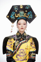 A Asian woman dressed in Qing Dynasty Empress attire