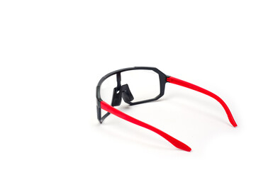 Cycling glasses for sports, unisex, plastic, with red temples.