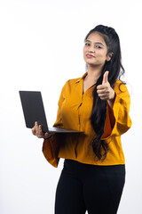 Young Indian, asian business woman, confident female entrepreneur holding laptop wearing professional outfit dress isolated on white background