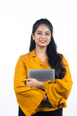 Young Indian, asian business woman, confident female entrepreneur holding laptop wearing professional outfit dress isolated on white background