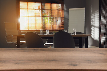 Empty wooden table in comfortable office. Space for design