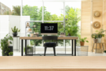 Empty wooden table in comfortable office. Space for design