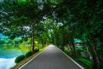 a public place leisure travel landscape lake views at Ang Kaew Chiang Mai University and Doi Suthep nature forest Mountain views spring cloudy sky background with white cloud.