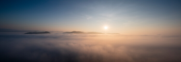 Panorama view. Sunrise with mist ,cloud and mountain.