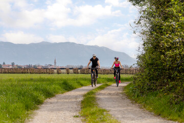 Couple on the bikes in beautiful nature in Slovenia