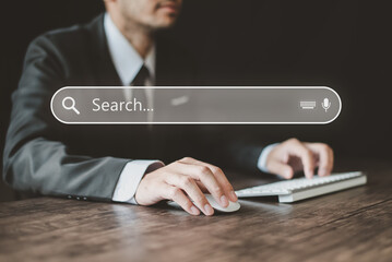 Data Search Technology Search Engine Optimization. A businessman in a suit is searching for information. Human hand using a keyboard to search for technical information. Search Console concept