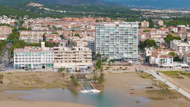 Aerial drone view of the coastal town named Comarruga in the province of Tarragona, Spain