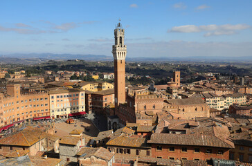 Fototapeta na wymiar View of Siena Cityscape with the Tower of Mangia Rising High