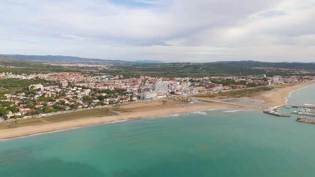Aerial drone view of the coastal town named Comarruga in the province of Tarragona, Spain