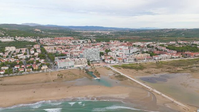Aerial drone view of the coastal town named Comarruga in the province of Tarragona, Spain