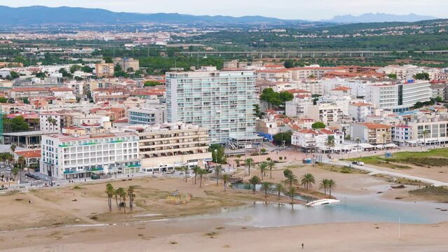 Aerial drone view of the coastal town named Comarruga in the province of Tarragona, Spain
