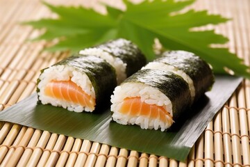 smoked salmon sushi roll on a bamboo mat