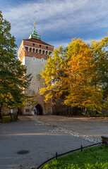 Florianska Gate (Brama Florianska), part of medieval gothic city fortification in the sunny autumn morning, Krakow, Poland