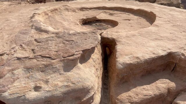 Ancient sacrificial alter carved into the stone with a channel for the blood to pool and flow from the high place of sacrifice