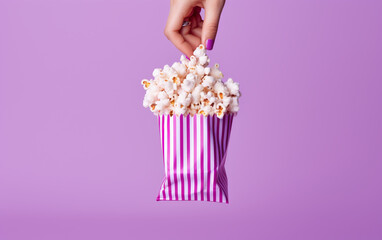 Hands Holding Pink Popcorn Bliss- hands holding pink popcorn