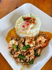 Rice topped with stir-fried pork and basil, Rice topped with stir fried minced pork and basil with Fried egg