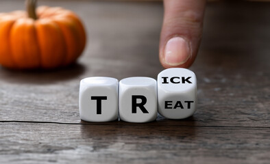 Dice form the words trick or treat.